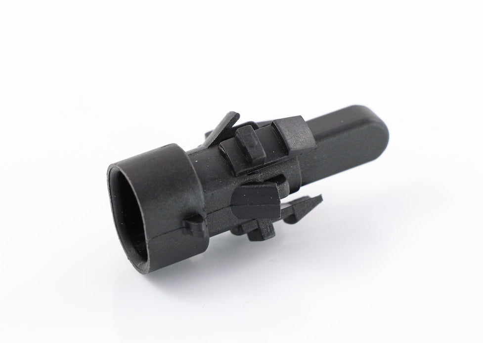 Advance Truck Parts USA 06-76773-000 outside air temperature sensor showing a close-up studio perspective of the black plastic housing, mounting clips, and probe tip