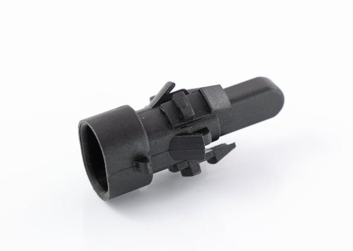 Advance Truck Parts USA 06-76773-000 outside air temperature sensor showing a close-up studio perspective of the black plastic housing, mounting clips, and probe tip