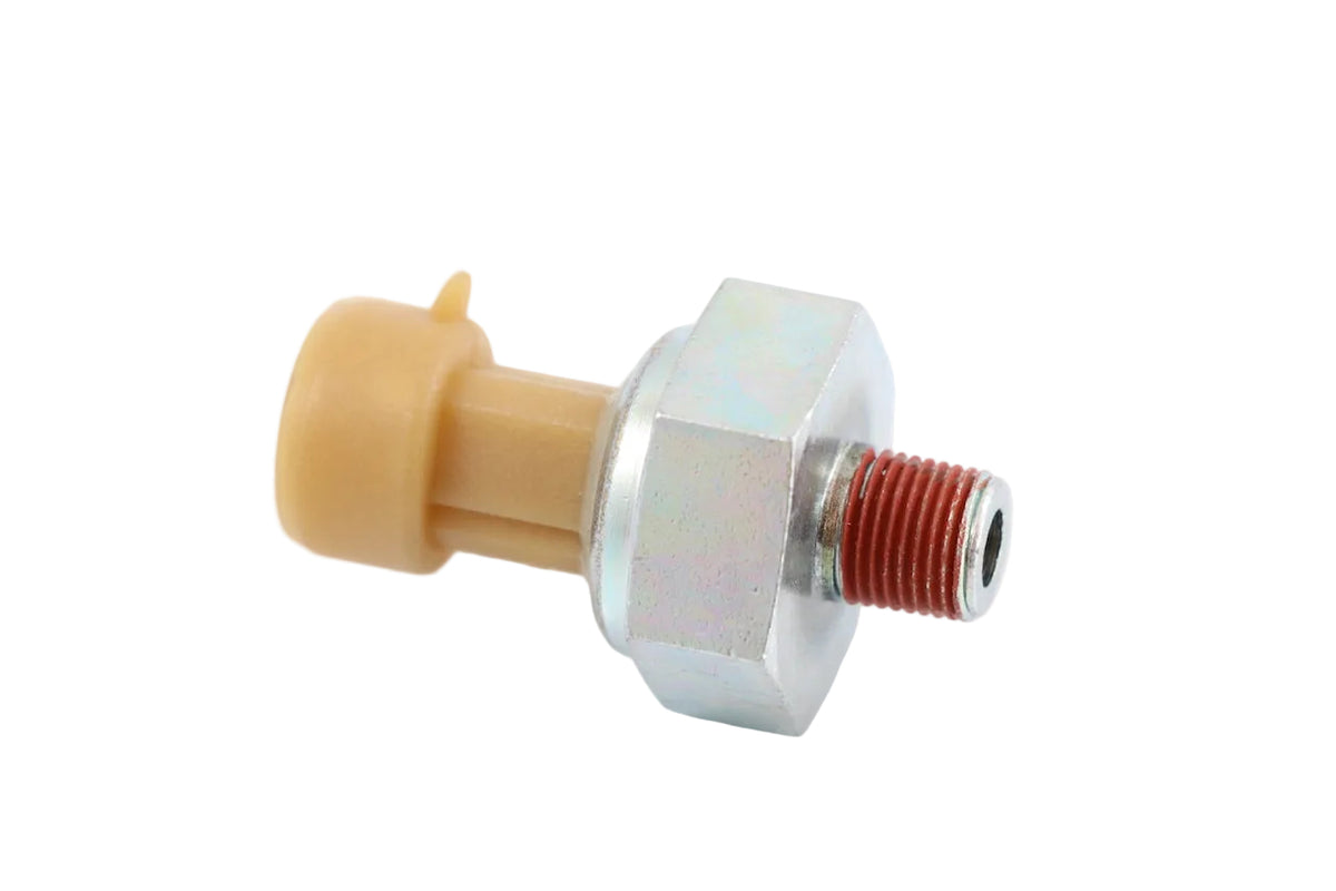 Advance Truck Parts USA 1807369C2 International engine oil pressure sensor showing a clean studio view of the threaded fitting with red sealant, metallic hex base, and tan connector housing 