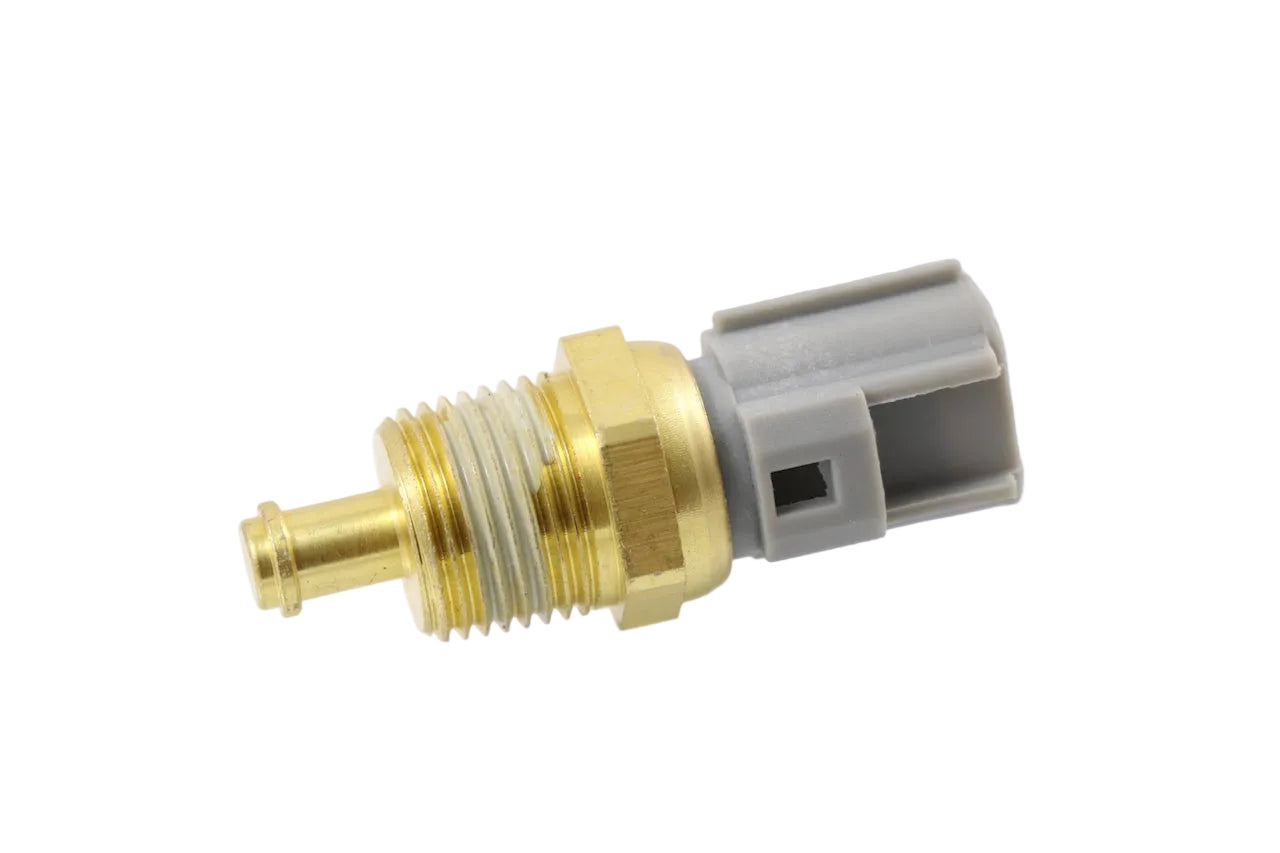 Advance Truck Parts USA 1889511C1 International engine coolant temperature sensor showing a clean studio view of the brass threaded body, probe, and grey connector housing on a plain white background