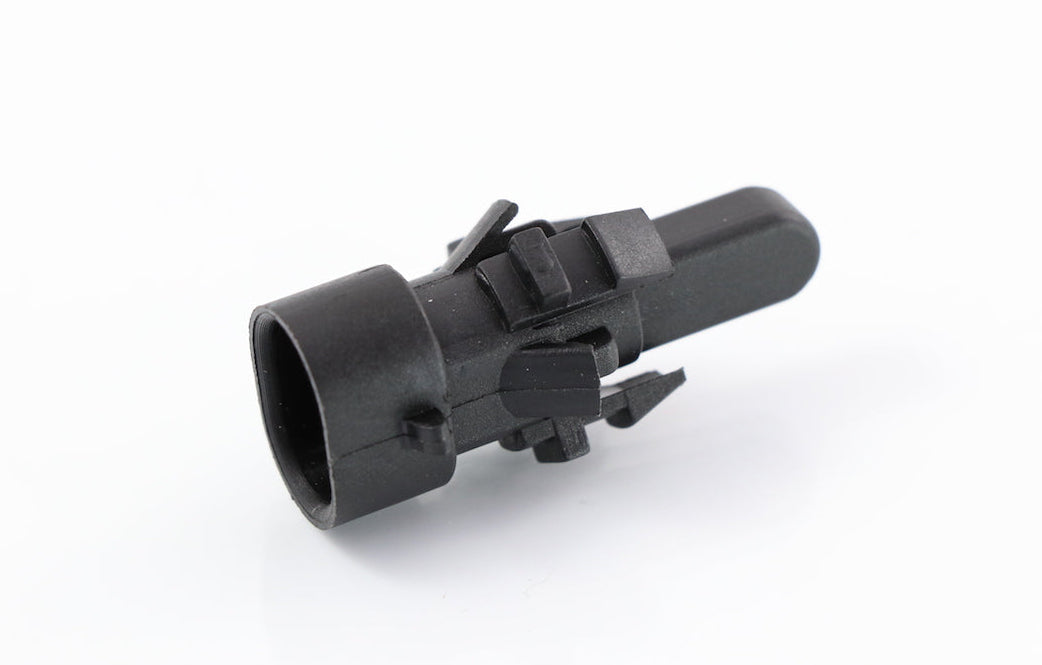 Advance Truck Parts USA 22-72747-000 black ambient air temperature sensor featuring snap-mount panel retention clips, oval connector barrel, and sensing probe tip