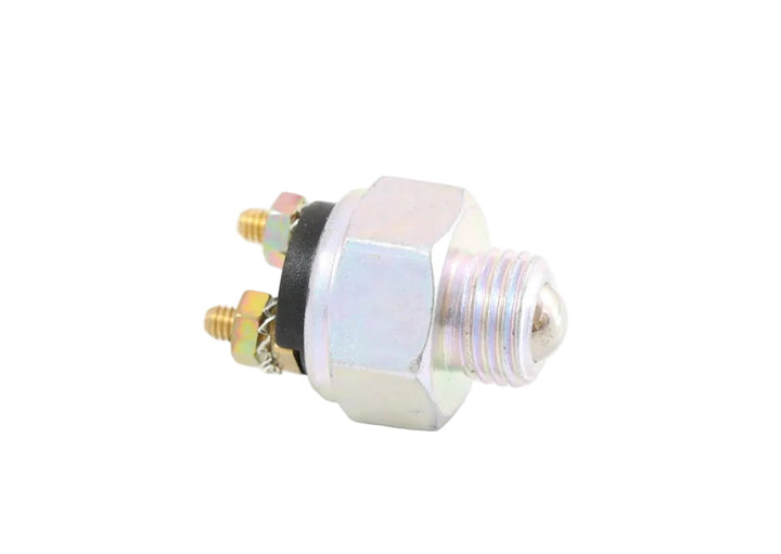 Advance Truck Parts USA 22940 backup reverse light switch showing a clean studio view of the threaded metal housing, ball actuator, and stud terminals 