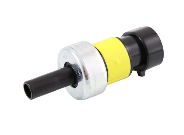 Advance Truck Parts USA 2596792C91 Navistar International pressure switch showing a close-up studio perspective of the yellow band, metal housing, and port tip