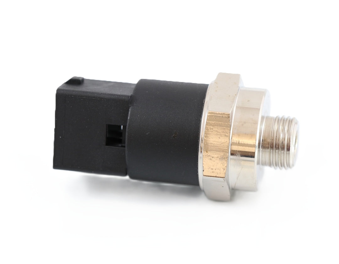Advance Truck Parts USA 3962893 Volvo oil pressure sensor showing a clean studio view of the threaded metal fitting, hex nut, and black square connector housing on a plain white background