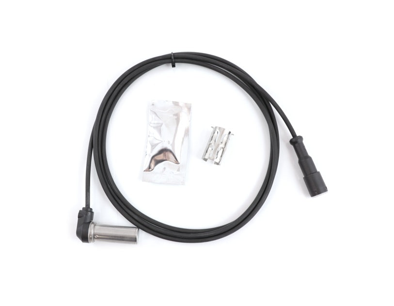 Advance Truck Parts WAB 4410328140 right angle ABS sensor kit showing a clean overhead flat-lay view of the 79-inch sensor harness, dielectric grease packet, and mounting clip on a plain white background