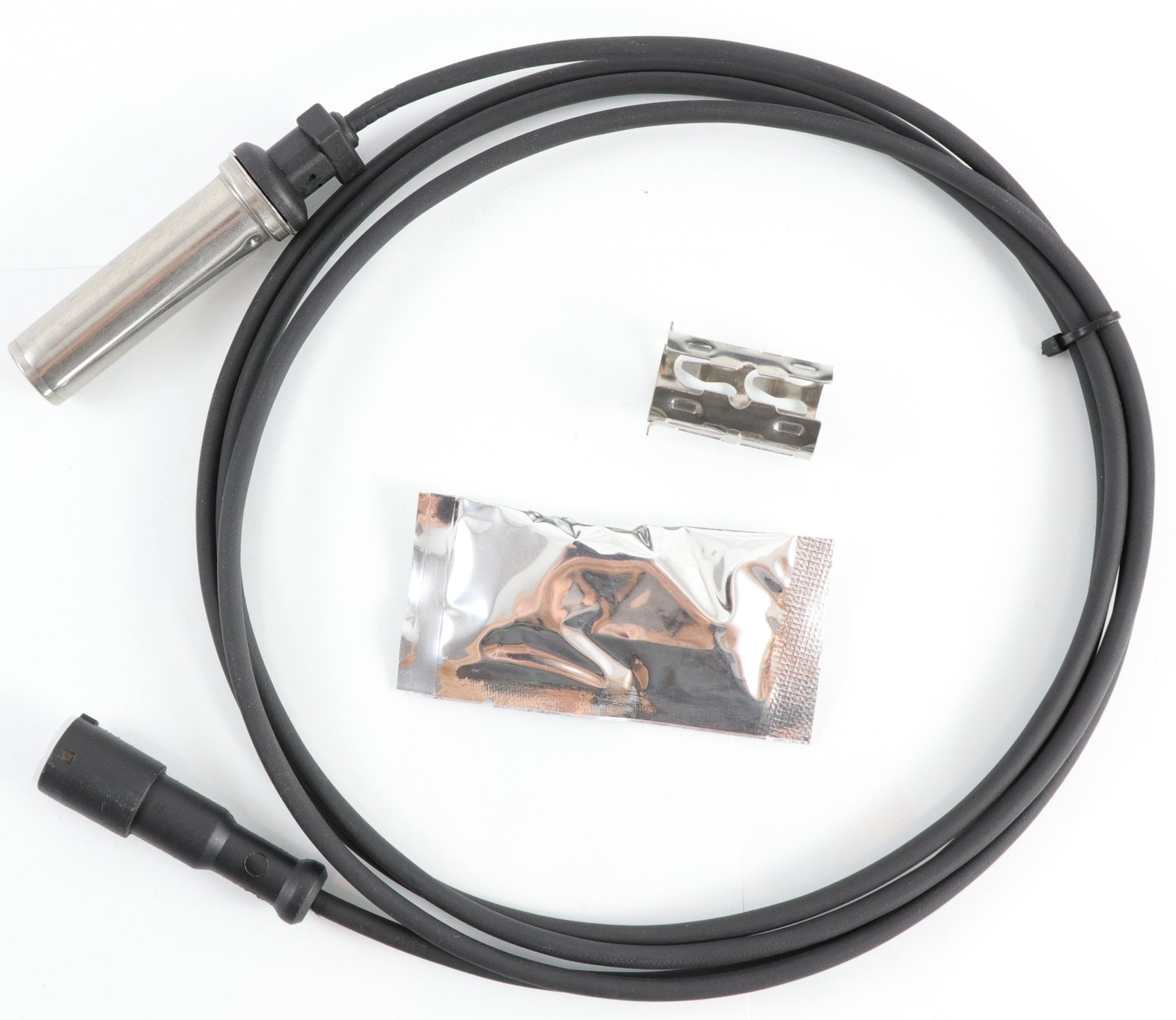 Advance Truck Parts USA R955349 straight ABS sensor kit showing a clean studio view of the 81-inch coiled wire harness, metal sensor probe, dielectric grease packet, and installation clip on a plain white background