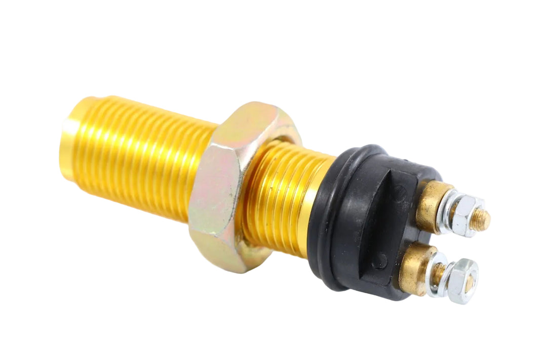 Advance Truck Parts USA W052055 magnetic pick-up sensor showing a clean studio view of the threaded brass body, mounting nut, and terminal studs on a plain white background