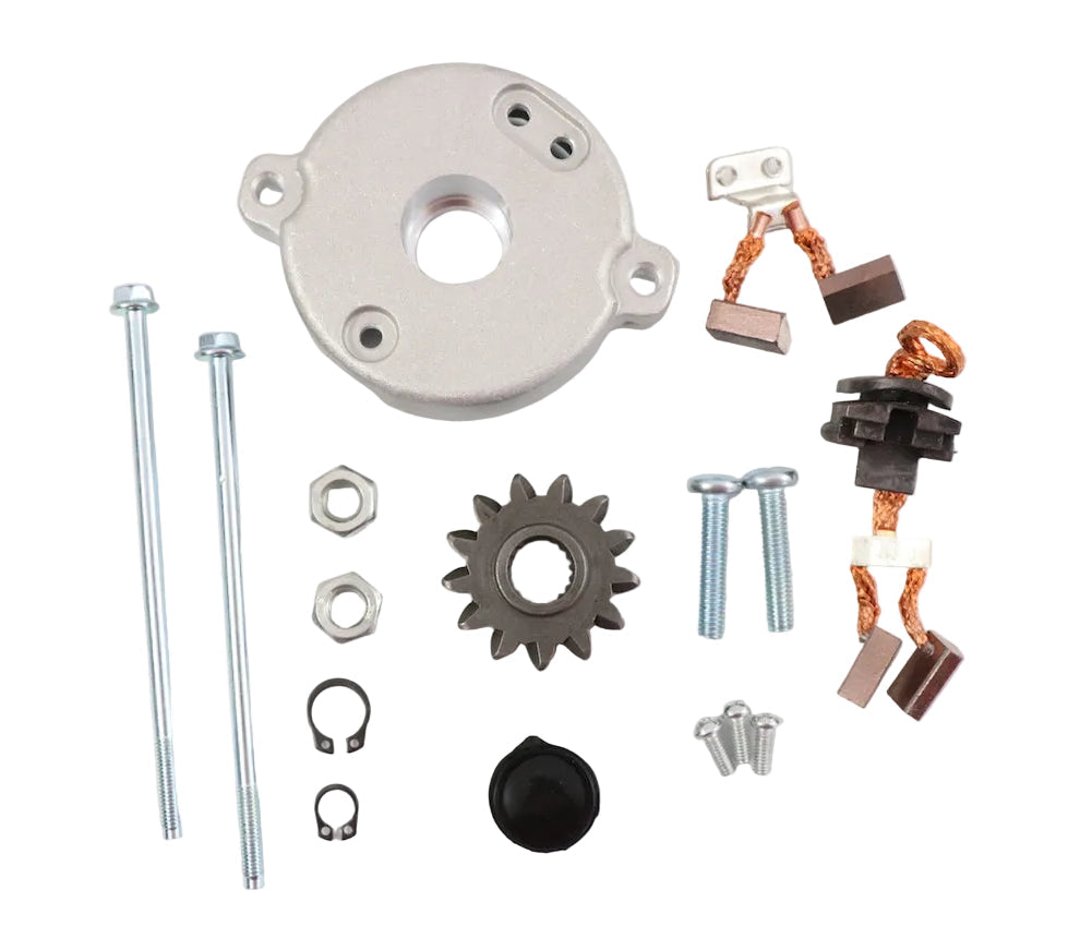 Advance Truck Parts USA WRK1100 Toyota PMGR starter repair kit showing a clean studio view of the back cover, drive gear, brushes, screws, nuts, and snap rings on a plain white background