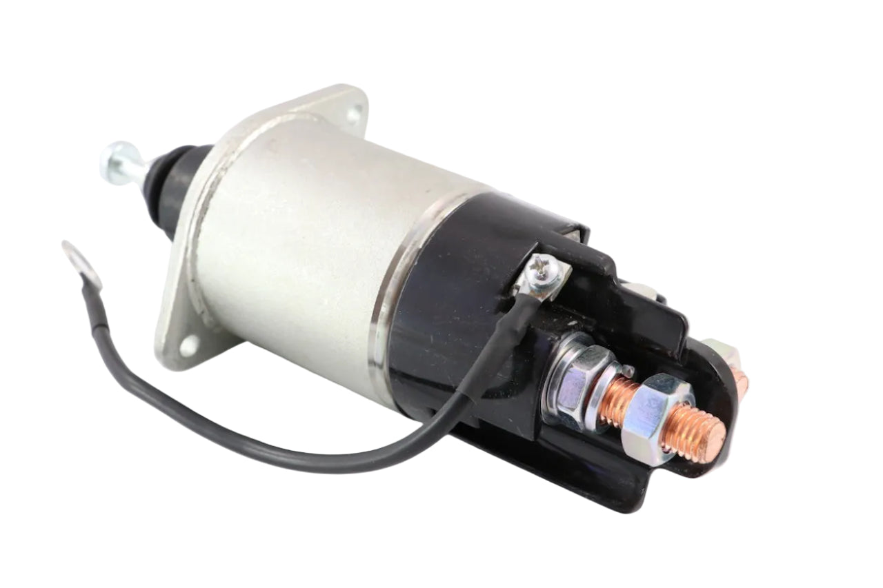 Advance Truck Parts USA 10511408 starter solenoid relay kit for Freightliner showing an angled profile of the cylindrical metal body, black end cap with heavy-duty copper terminals, and grounding wire on a plain white background
