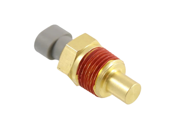 Advance Truck Parts USA 1675751C1 temperature sender gauge for International Navistar buses and trucks showing an angled studio view of the brass threaded body with red sealant and grey electrical connector 