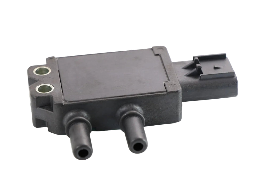 Advance Truck Parts USA 1818119PE exhaust gas DPF differential pressure sensor for Cummins showing an angled top profile of the black plastic housing, two pneumatic ports, metal mounting inserts, and side electrical connector on a plain white background