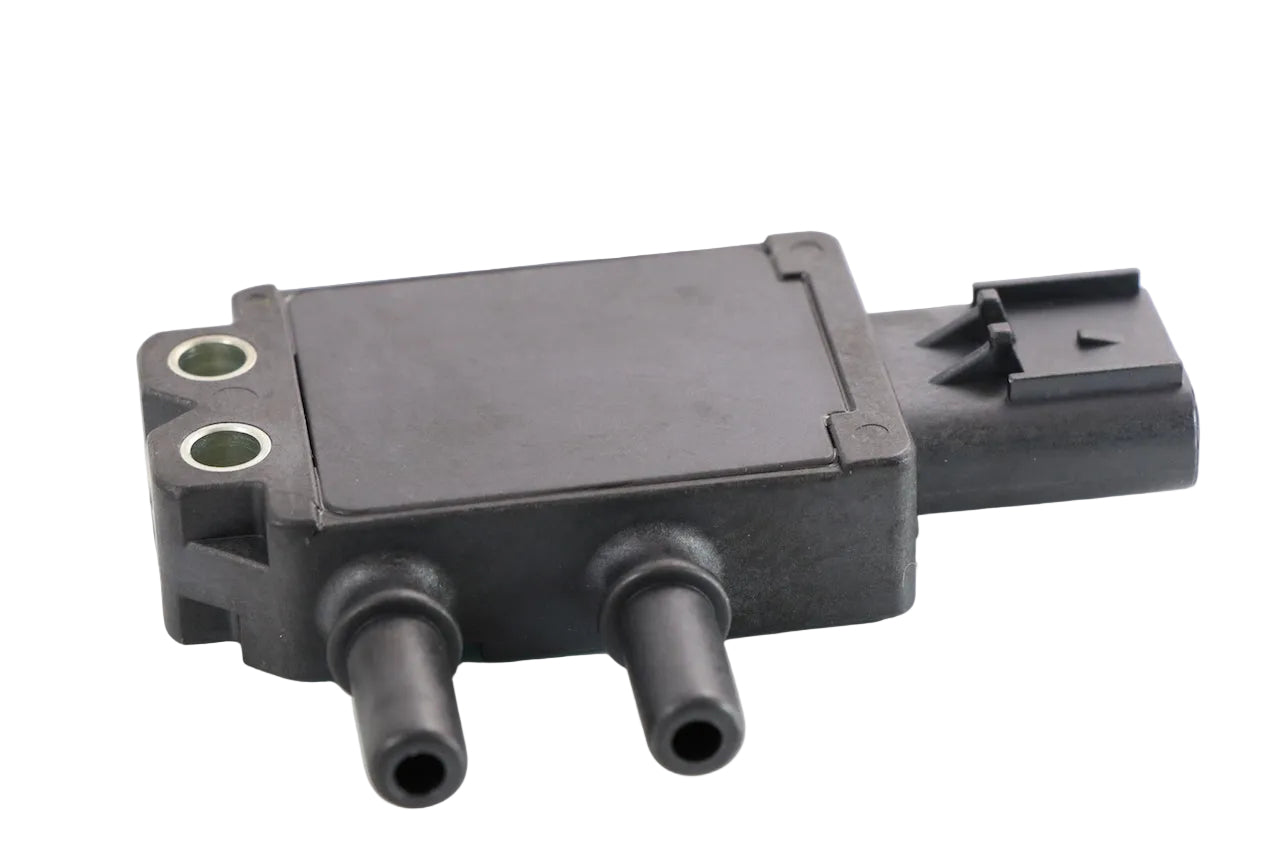 Advance Truck Parts USA 1818119PE exhaust gas DPF differential pressure sensor for Cummins showing an angled top profile of the black plastic housing, two pneumatic ports, metal mounting inserts, and side electrical connector on a plain white background