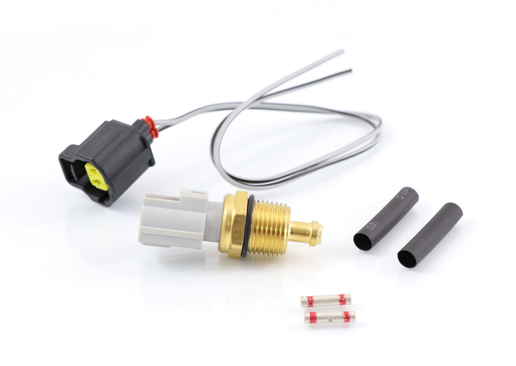 Advance Truck Parts USA 1889995C91 oil and coolant temperature sensor kit for International Navistar trucks featuring a sensor, pigtail harness, heat shrink tubes, and butt connectors on a plain background
