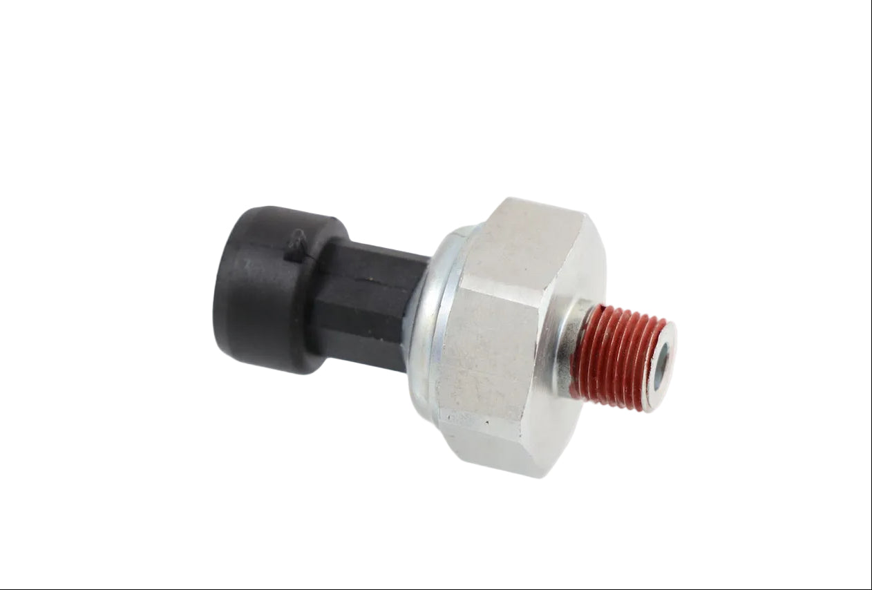 Advance Truck Parts USA 20706315 oil pressure sensor for Mack and Volvo trucks featuring a hex fitting, threaded port with red sealant, and a black connector on a plain background