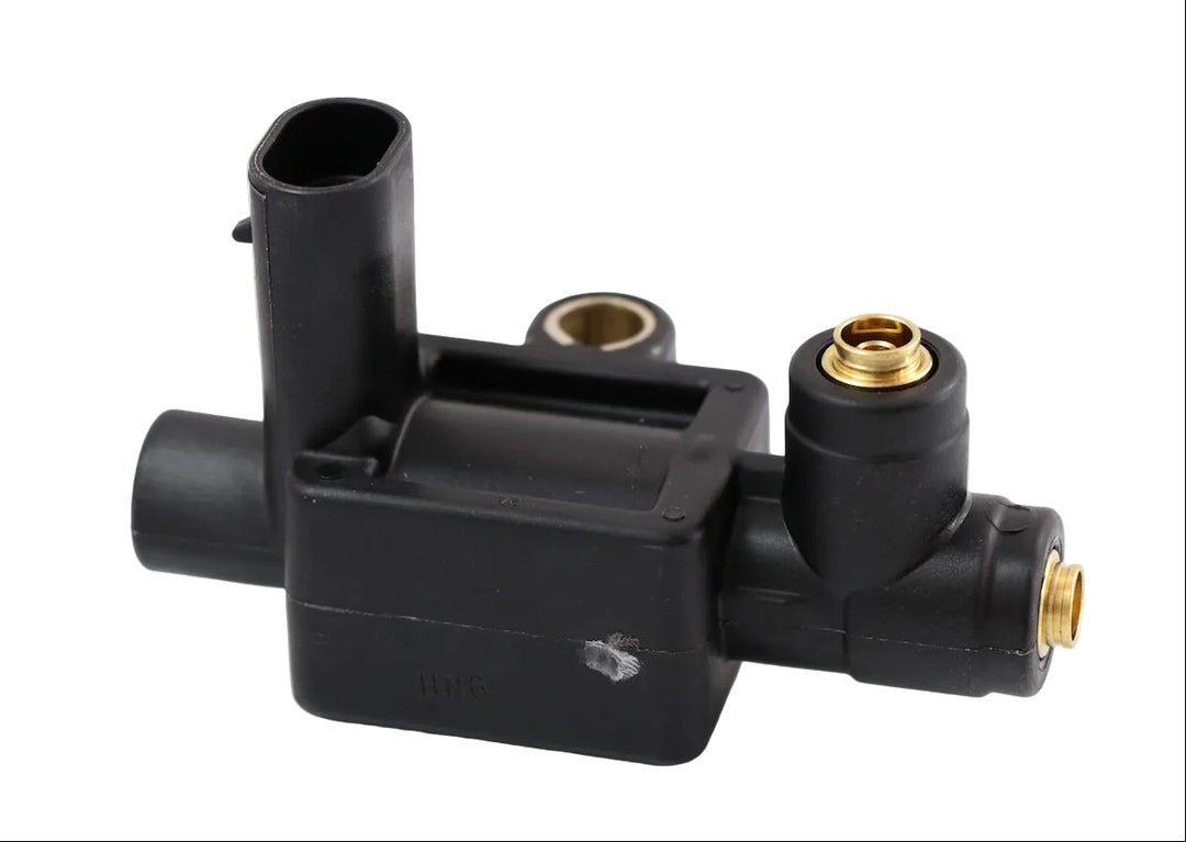 Advance Truck Parts ATP 20807261 solenoid fan clutch valve for Mack and Volvo trucks featuring a black plastic housing and brass ports on a plain background