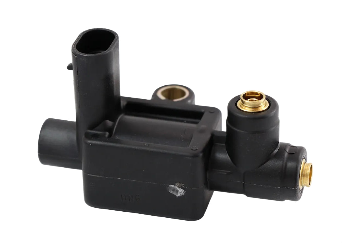 Advance Truck Parts ATP 20807261 solenoid fan clutch valve for Mack and Volvo trucks featuring a black plastic housing and brass ports on a plain background