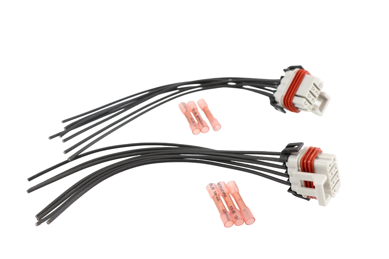 Advance Truck Parts USA 224-396-007 headlight wiring harness connector pigtail kit for Freightliner Columbia featuring two connector plugs and butt splices on a plain background