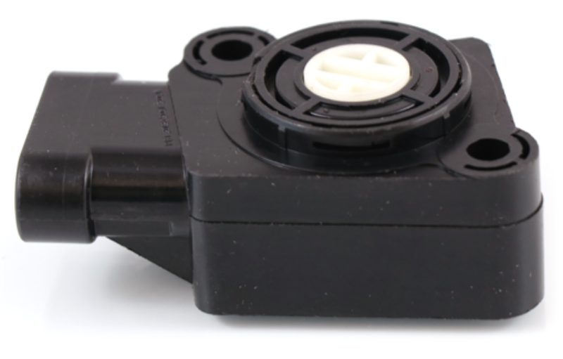 Advance Truck Parts USA 2607117C91 throttle position sensor for Navistar trucks showing an angled profile of the black plastic housing, mounting screw holes, and white central rotor on a plain white background