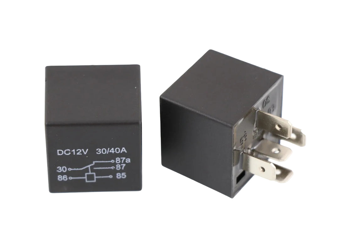 Advance Truck Parts 777-015 5-pin 30/40 amp sealed automotive relay showing the wiring diagram printed on the housing next to a second unit displaying the metal terminal blades on a plain white background