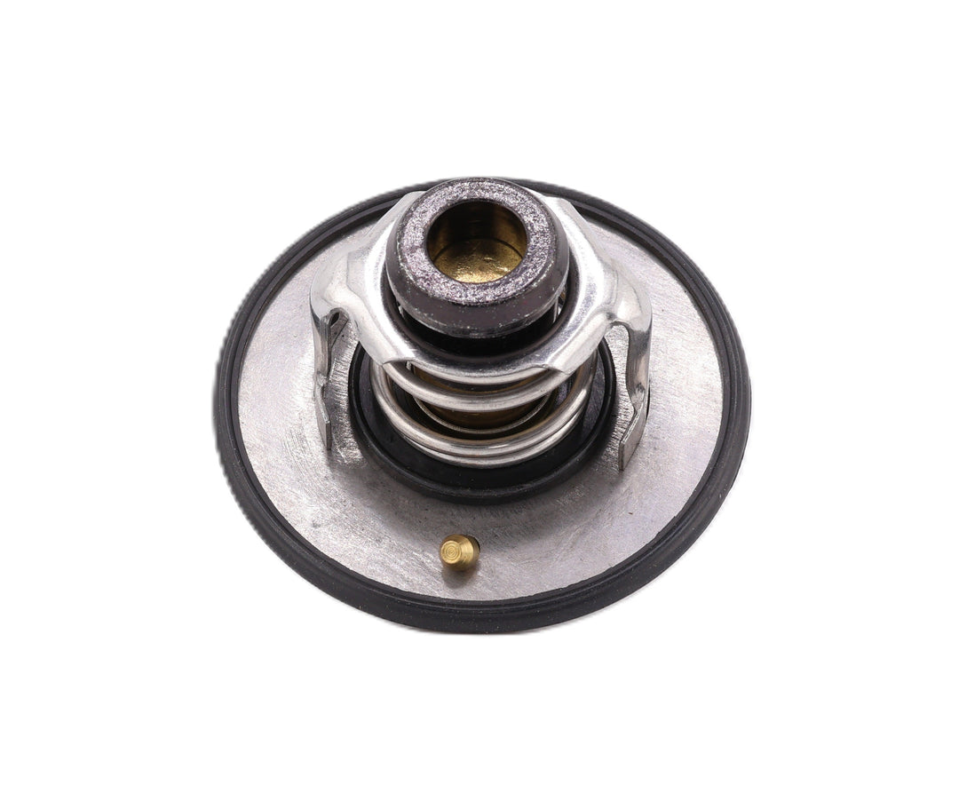 Advance Truck Parts USA 5292712 3954830 190F degree thermostat kit showing a top down perspective of the metallic housing, jiggle pin, and black rubber seal on a plain background
