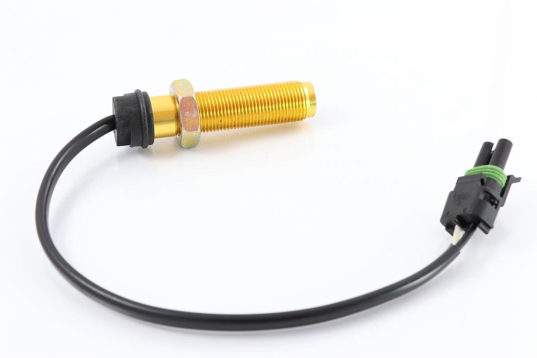 Advance Truck Parts USA 8078108 Volvo truck speed sensor featuring a threaded brass body, hex nut, wire lead, and connector on a plain background