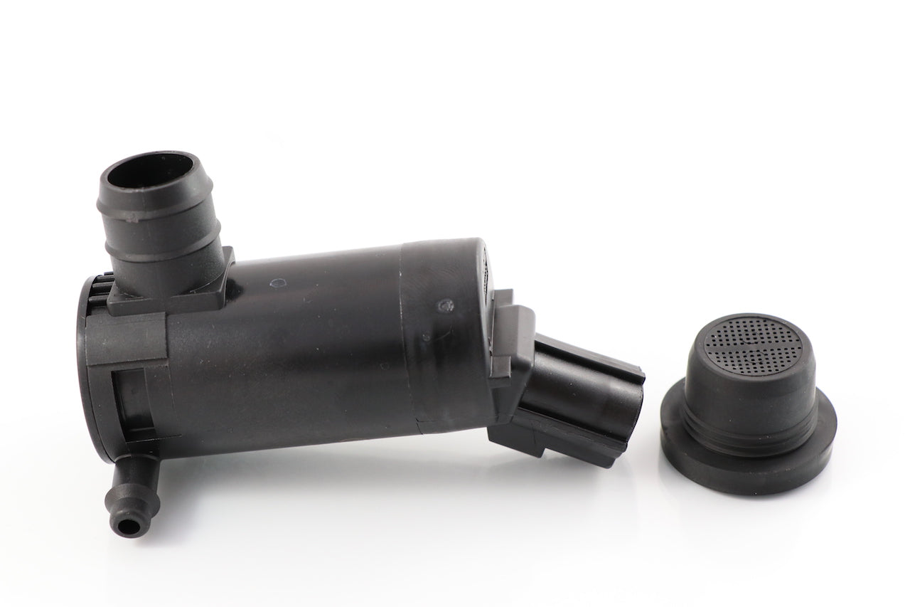 Advance Truck Parts A22-53729-000 windshield washer pump for Freightliner trucks showing an angled studio view of the black plastic pump body, fluid nozzles, 2-pin connector, and rubber screen grommet on a plain white background