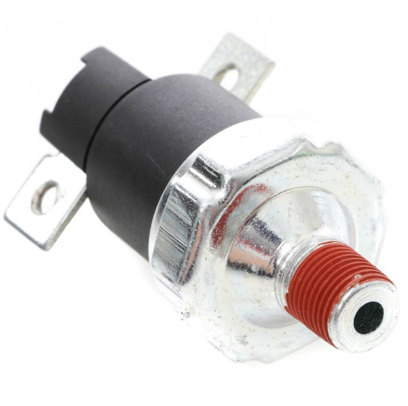 Advance Truck Parts USA BA26900 70 PSI low air pressure switch for Paccar showing an angled profile of the black top connector with metal mounting tabs, silver metallic housing, and threaded pneumatic port with red thread sealant 