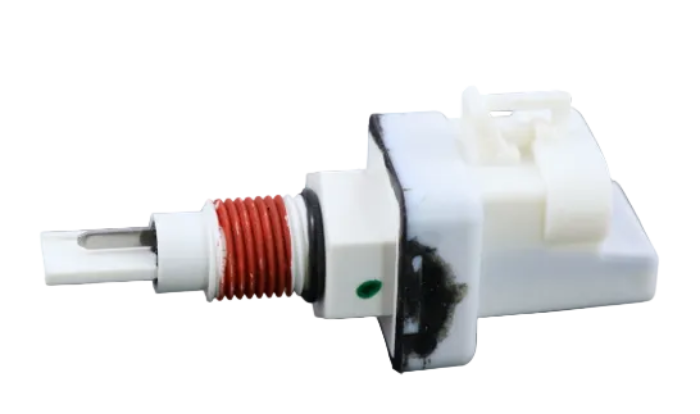 Advance Truck Parts USA CAS700685-001 engine coolant level sensor featuring a white plastic body, red-threaded tip, and oval connector on a plain background
