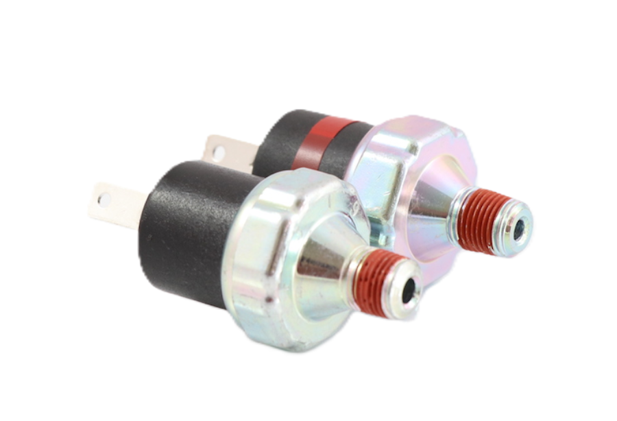Advance Truck Parts USA FSC 2749-2108 and FSC 1749-1907 air pressure switch kit showing a front angled perspective highlighting the red threaded sealant, metal housing, and 2-blade connectors on a plain background