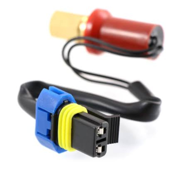 Advance Truck Parts USA K301-401 high pressure switch for Kenworth showing an angled profile of the brass female M10 threaded port, red protective boot, wiring harness, and 2-pin electrical connector with a blue lock on a plain white background