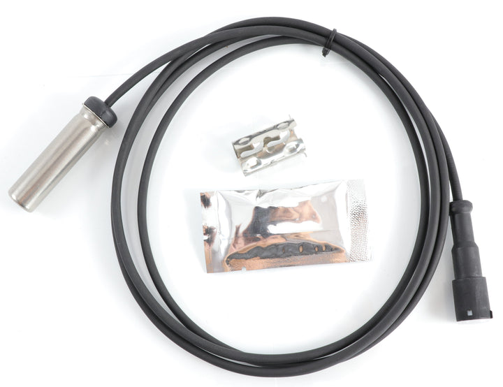Advance Truck Parts R955337 anti-lock brake system sensor kit showing an overhead view of the wired sensor probe, dielectric grease packet, and retaining clip on a plain white background