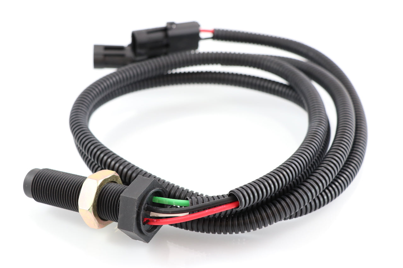 Advance Truck Parts USA SAA85920013 4-wire speed sensor for Freightliner showing a coiled profile of the black threaded body, locking nuts, colored wires entering the black corrugated wire loom, and dual electrical connectors on a plain white background