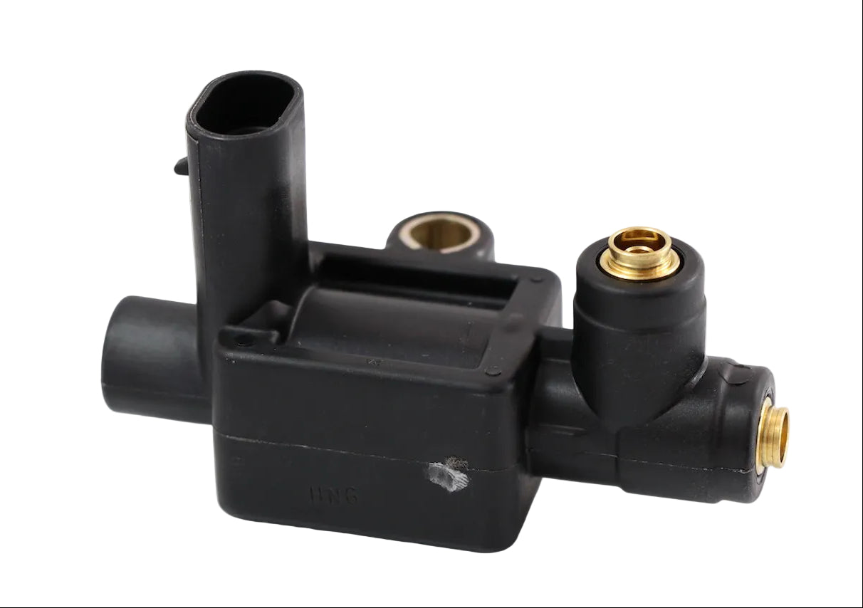 Advance Truck Parts USA solenoid fan clutch 3-way valve replacing Volvo part 20807261 featuring a black plastic housing and brass ports on a plain background