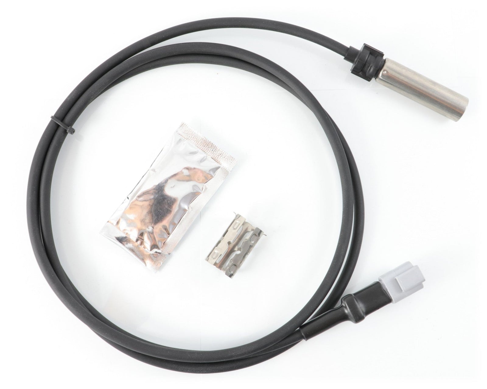 Advance Truck Parts USA 801553 801175 straight ABS sensor kit featuring a 43-inch sensor cable, dielectric grease packet, and metal mounting clip on a plain background