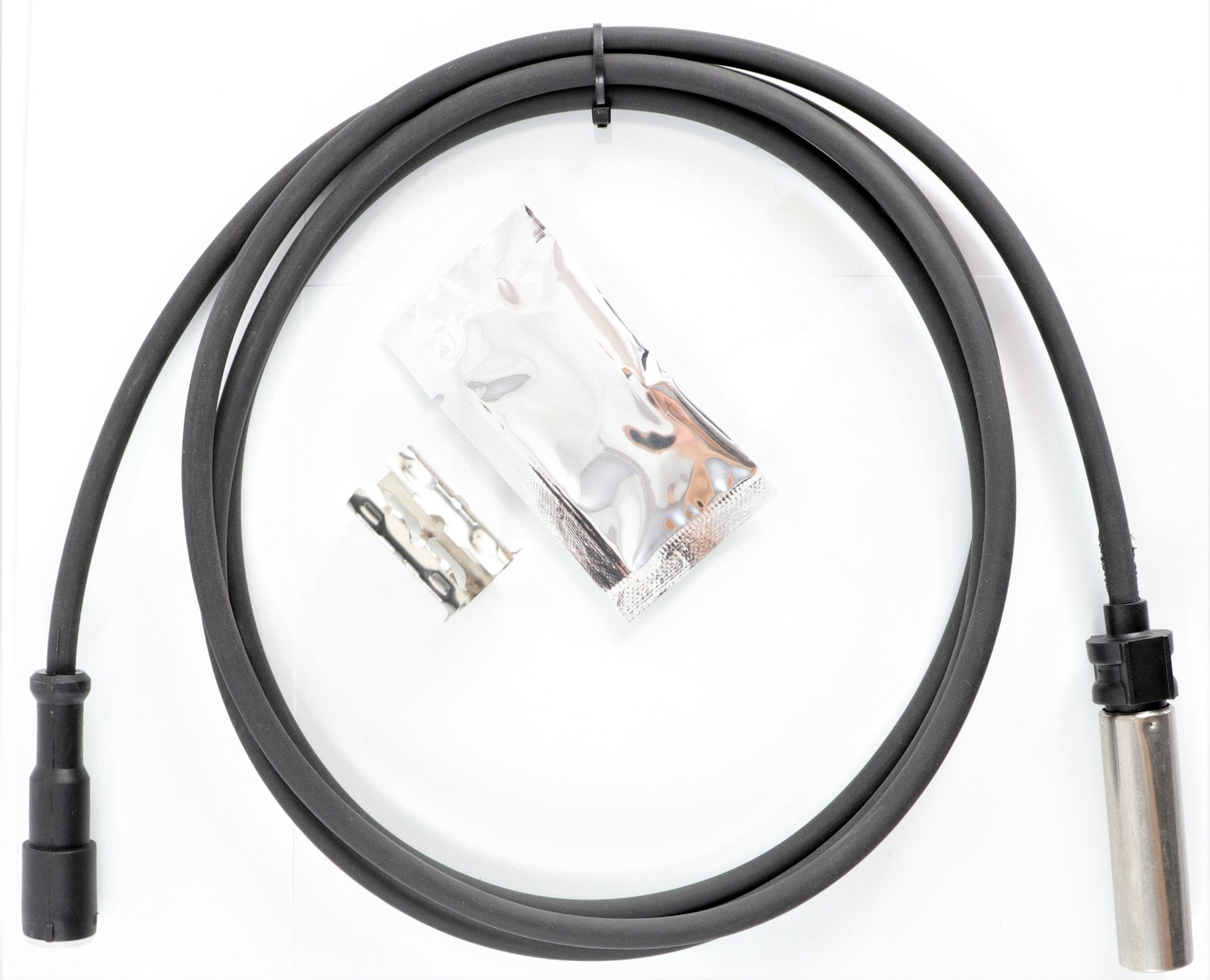 Advance Truck Parts USA 441 030 905 2 ABS wheel speed sensor kit with coiled wiring harness, mounting clip, and grease packet on a plain background