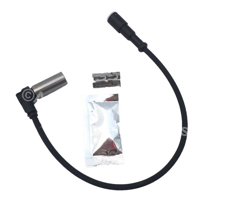 Advance Truck Parts USA ABS sensor kit showing a studio layout of the sensor assembly, dielectric grease packet, and metal clip