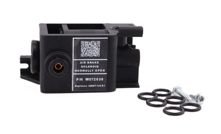 Advance Truck Parts USA W072038 air brake solenoid valve kit showing a horizontal profile of the black normally open 12V housing with a printed QR code label, six rubber O-rings, and two mounting screws on a plain white background