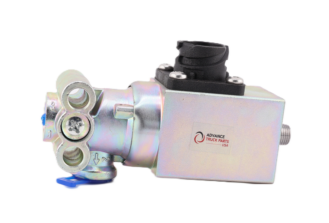 Advance Truck Parts USA W072047 solenoid valve showing a horizontal profile of the metallic housing with a printed logo, black top-mounted electrical connector, and mounting flange with blue protective caps on a plain white background