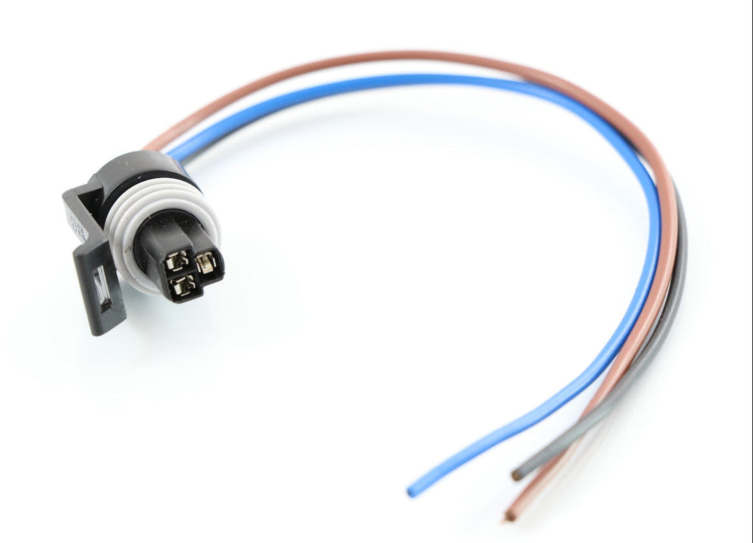 Advance Truck Parts USA W094115 3-pin pigtail connector for coolant level sensors featuring a black connector housing, rubber seal, and colored wire leads