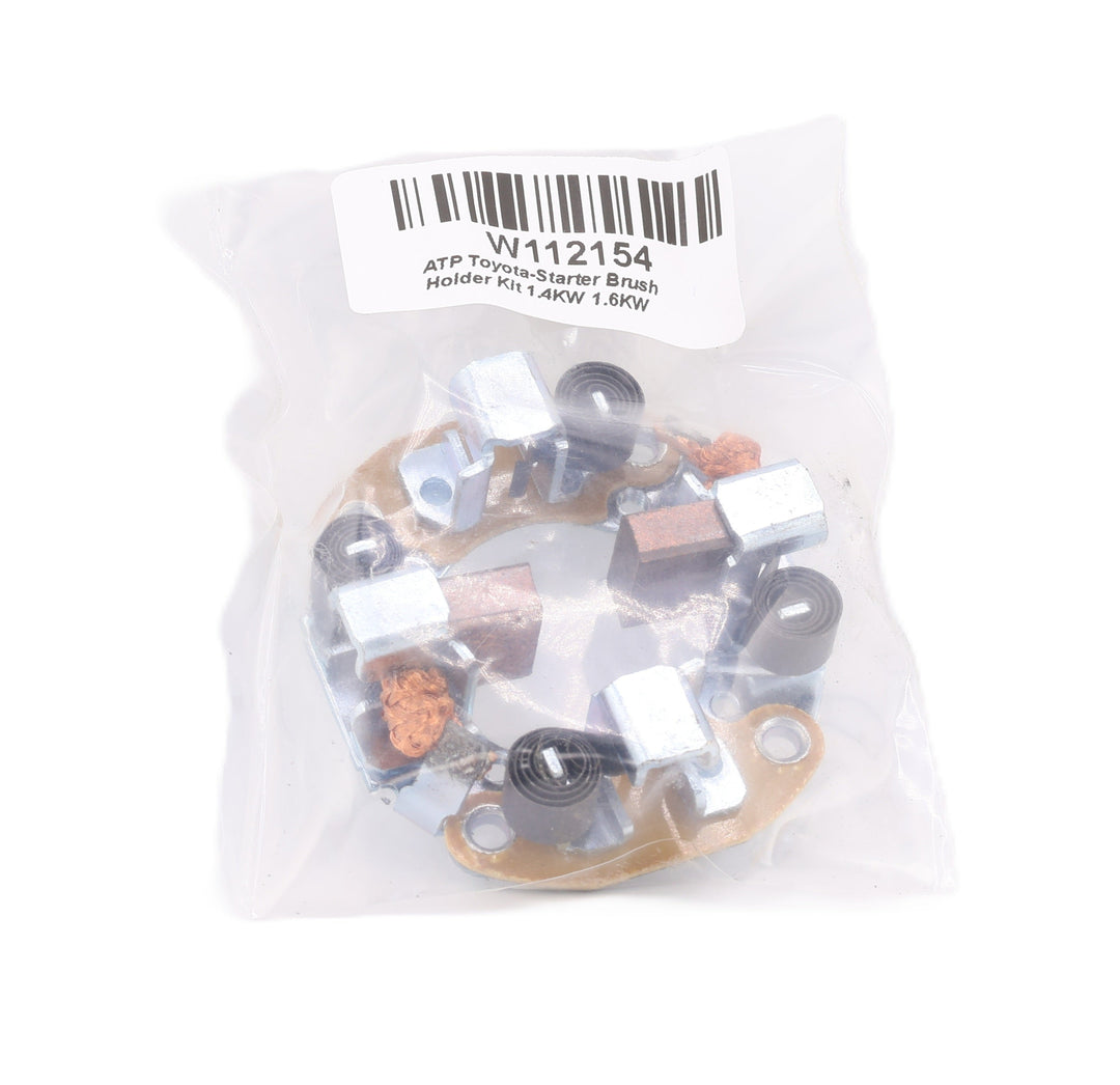 Advance Truck Parts USA W112154 starter brush holder kit showing the metallic brush holder assembly and two brushes sealed in a clear plastic bag with a printed product label on a plain background