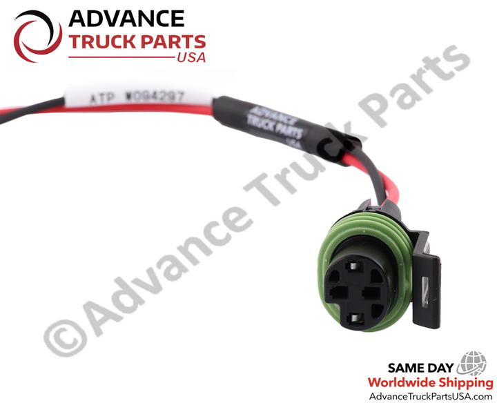 Advance Truck Parts A66-23214-000 12-26770-000 Jumper Harness close-up view of green circular 2-pin connector