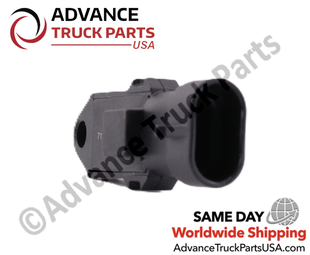 Advance Truck Parts USA branded studio angled perspective from the rear connector end highlighting the oval housing, black plastic body, and side profile of the heavy-duty ambient air sensor for Cummins engines