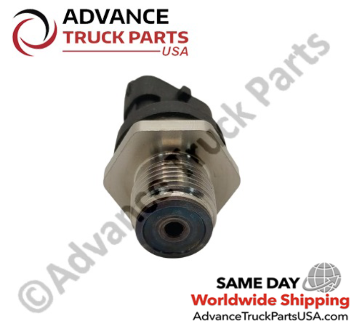 Advance Truck Parts USA branded studio angled bottom perspective highlighting the high-pressure threaded mounting base and central fluid intake port of the commercial Cummins fuel rail pressure sensor