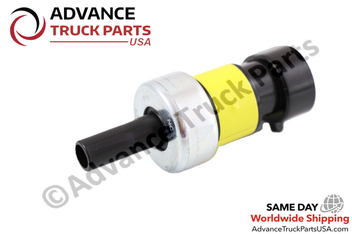 Advance Truck Parts USA branded studio angled perspective showcasing the heavy-duty brake and cruise control pressure switch featuring a black pneumatic port, metallic housing, yellow band, and black connector for Navistar International commercial trucks