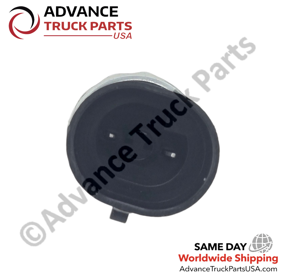 Advance Truck Parts USA studio close-up top perspective looking directly into the black plastic receptacle, revealing two recessed metal connection pins on the replacement heavy-duty pressure switch