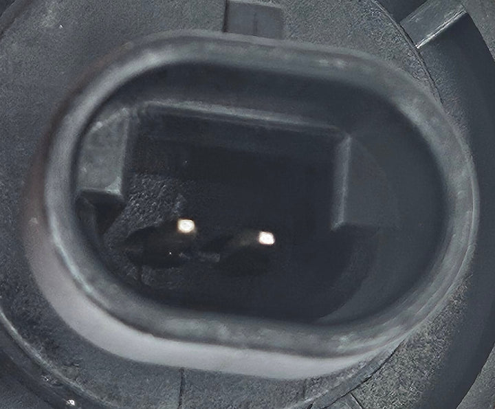 Advance Truck Parts USA washer fluid low level sensor showing a macro detail of the 2-pin electrical connector terminals