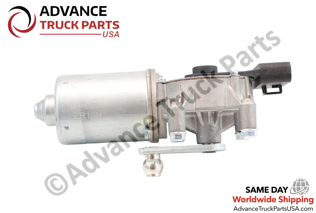 Advance Truck Parts USA International wiper motor showcasing a horizontal side profile of the silver cylindrical housing and the lower metallic ball-joint linkage arm
