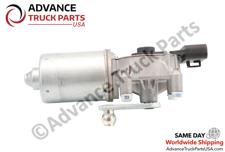 Advance Truck Parts USA International wiper motor showcasing a horizontal side profile of the silver cylindrical housing and the lower metallic ball-joint linkage arm
