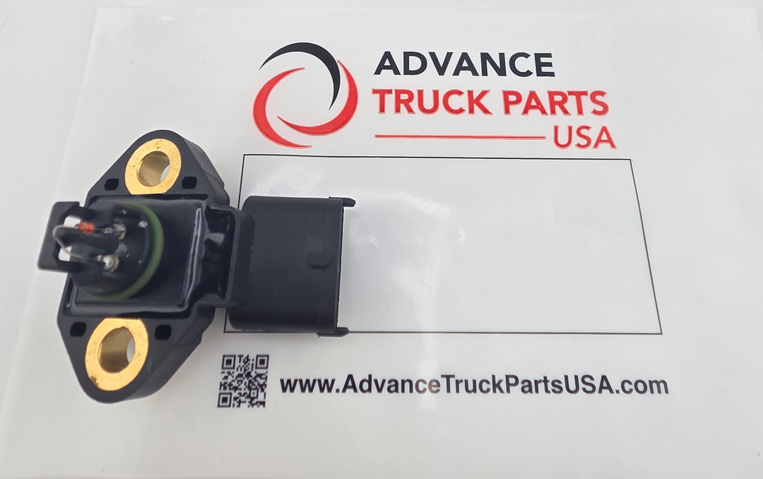 Advance Truck Parts USA DDE A9901530028 heavy duty exhaust pressure sensor showing the sensor resting on branded packaging with its dual mounting holes, green o-ring, and 3-pin sealed connector