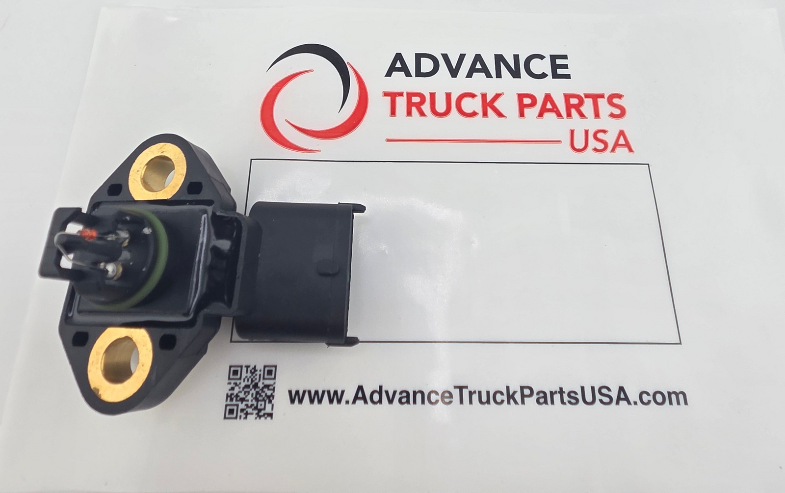 Advance Truck Parts USA DDE A9901530028 heavy duty exhaust pressure sensor showing the sensor resting on branded packaging with its dual mounting holes, green o-ring, and 3-pin sealed connector